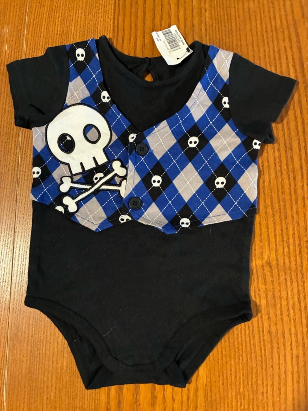 Spencer’s Baby Onesie- black and blue skull theme